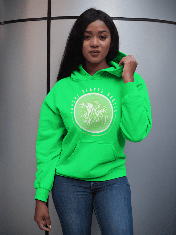 A woman in a neon green hoodie is standing up.