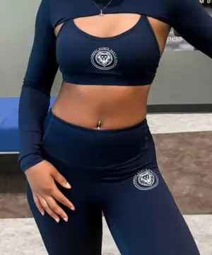 Woman in navy blue athletic outfit.