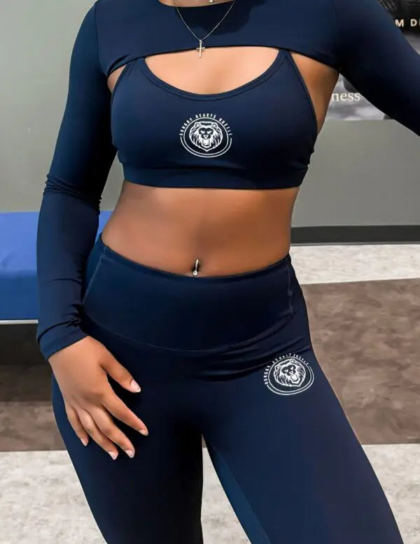 Woman in navy blue athletic outfit.