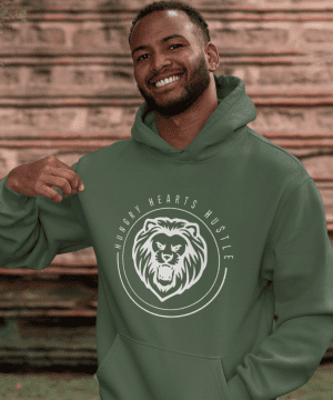 A man wearing a green hoodie with a bear logo.