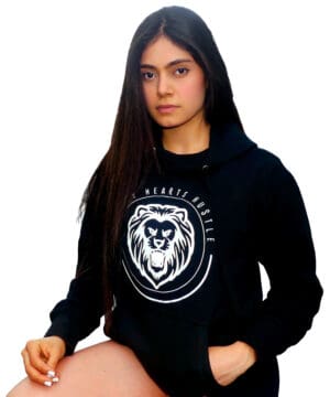 A woman in black hoodie with white logo.