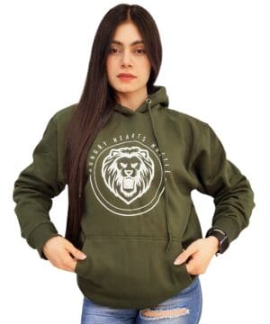 A woman wearing a green hoodie with a lion logo on the front.