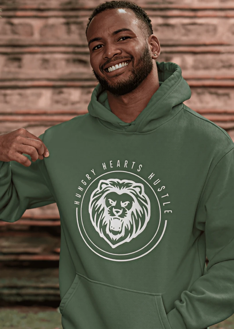 Man wearing green hoodie with lion emblem